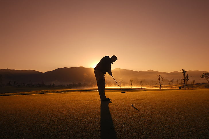 golf-silhouette-on-man-putting
