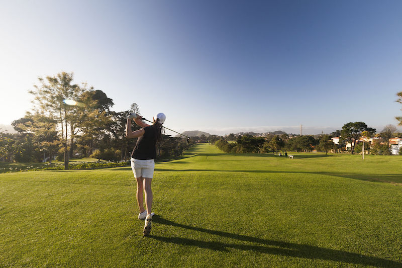 woman-driving-golf-ball